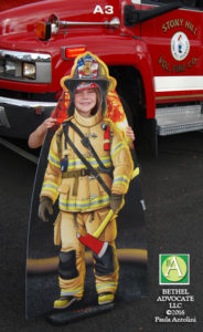 BA38_0285girlbehindemsboardstonyhillfire