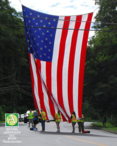 ba15_0141bethelfirefightersholdflag