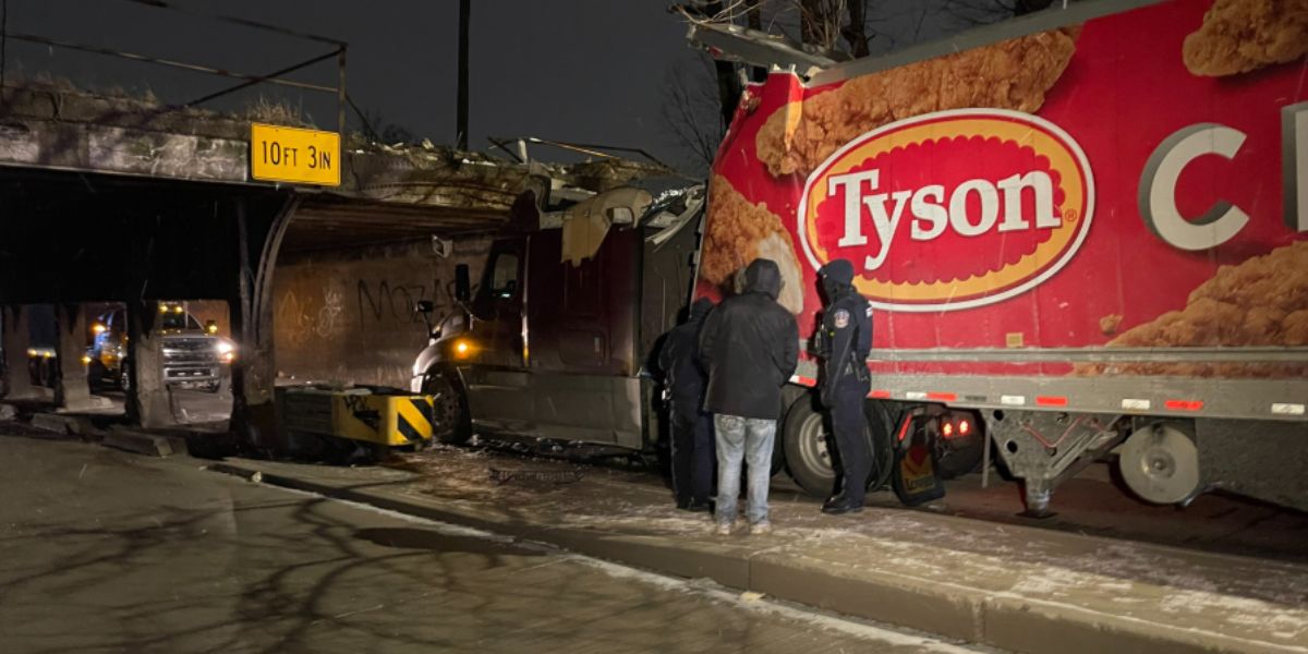 Semi Truck Becomes Wedged Under Overpass in Indianapolis, Causing Damage but No Injuries
